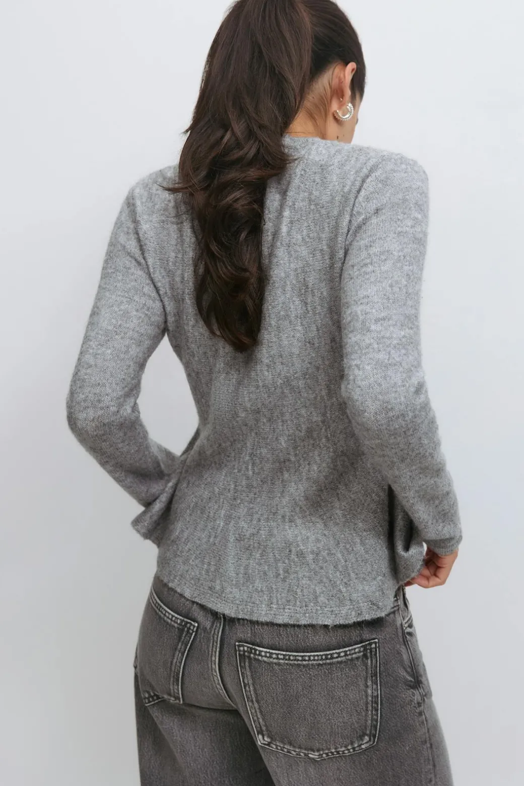 Knitted peplum cardigan