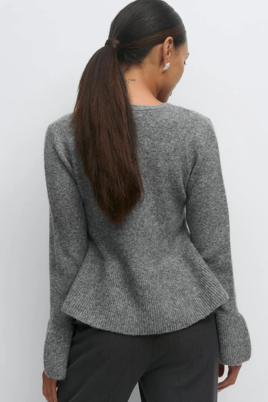 Knitted peplum cardigan