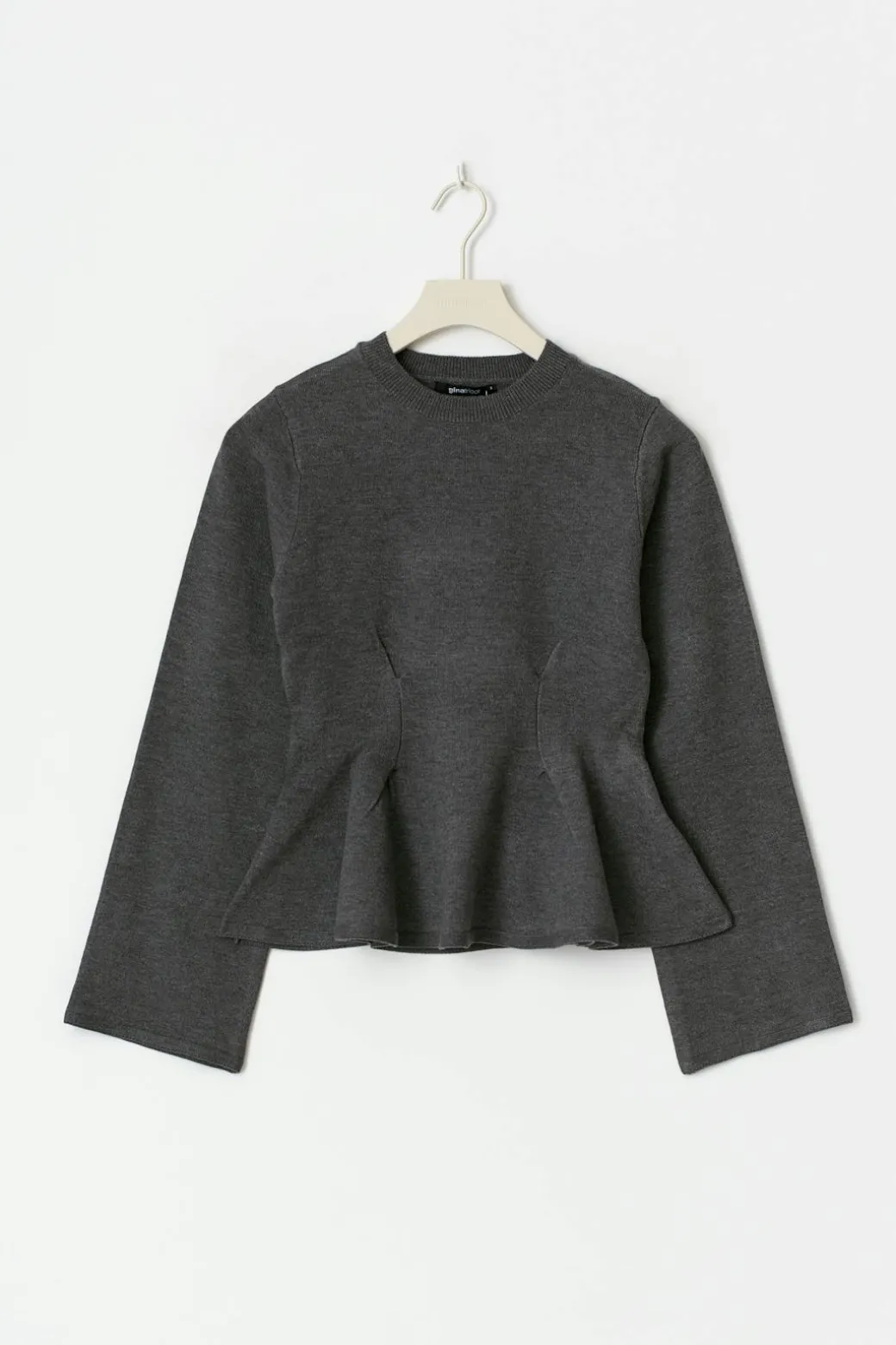 Knitted peplum top