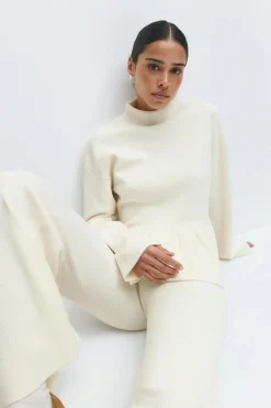 Knitted peplum top