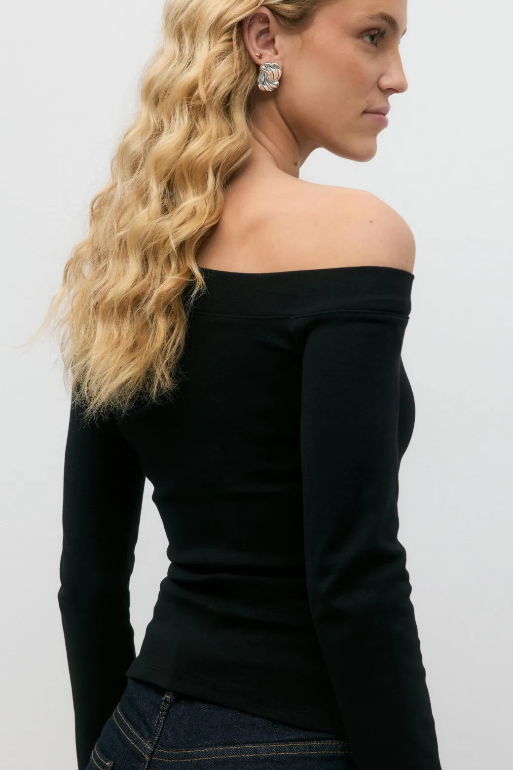 Sloped shoulder top